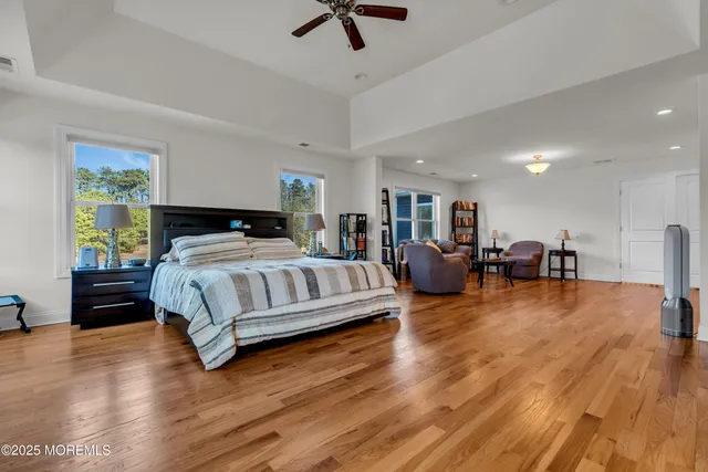 a view of a grassy field with trees
