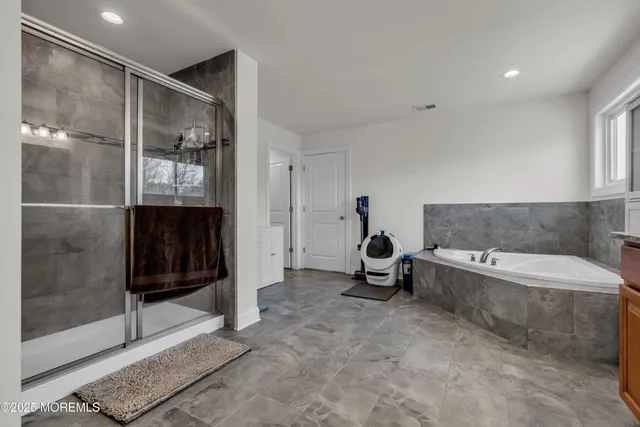 an aerial view of a house with a big yard