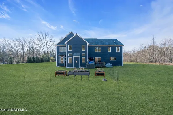 a view of a house with a yard porch and sitting area