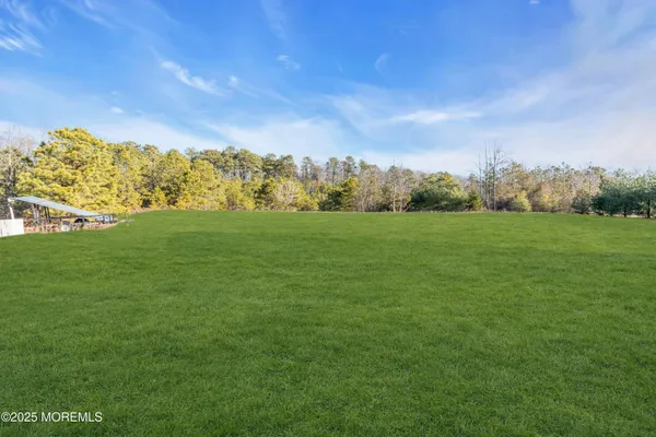 a view of field with mountain in the background