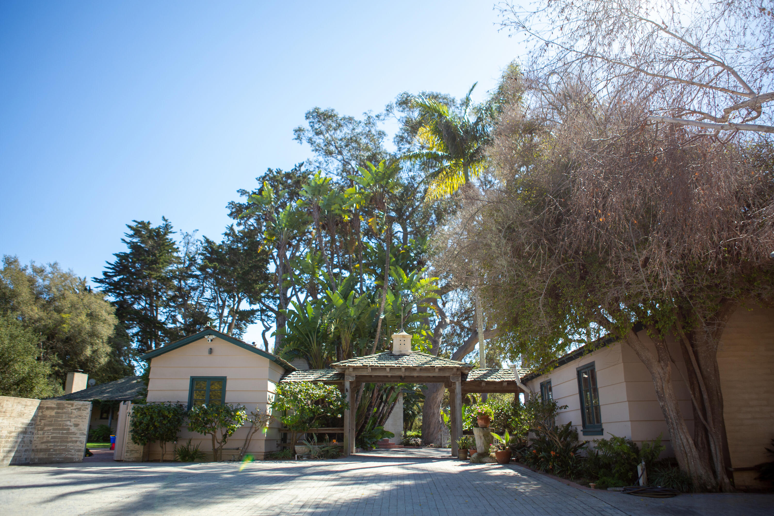 4395 Via Esperanza Santa Barbara, CA 93110 - Photo 3 of 23 a front view of a house with a yard and garage