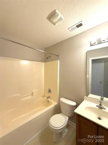 a bathroom with a sink a toilet and a bathtub