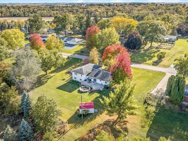 an aerial view of residential houses with outdoor space