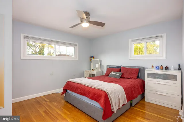 a bedroom with bed and window