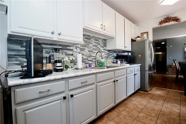a kitchen with cabinets and window