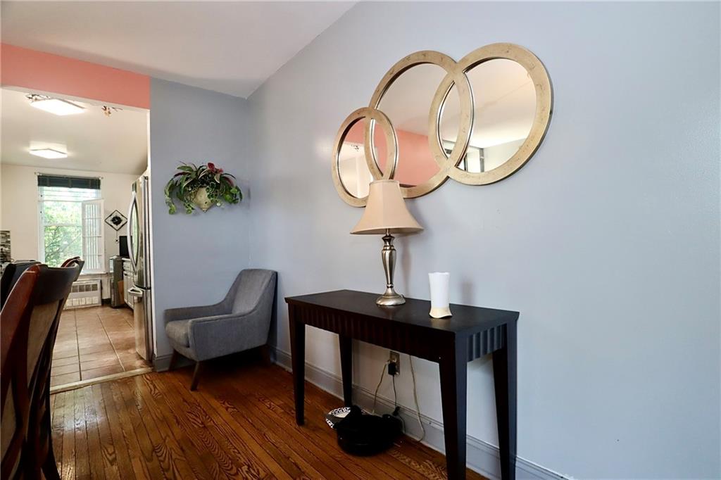 848 Park Place, Unit 4E Brooklyn, NY 11216 - Photo 8 of 22 a view of a livingroom with furniture and wooden floor