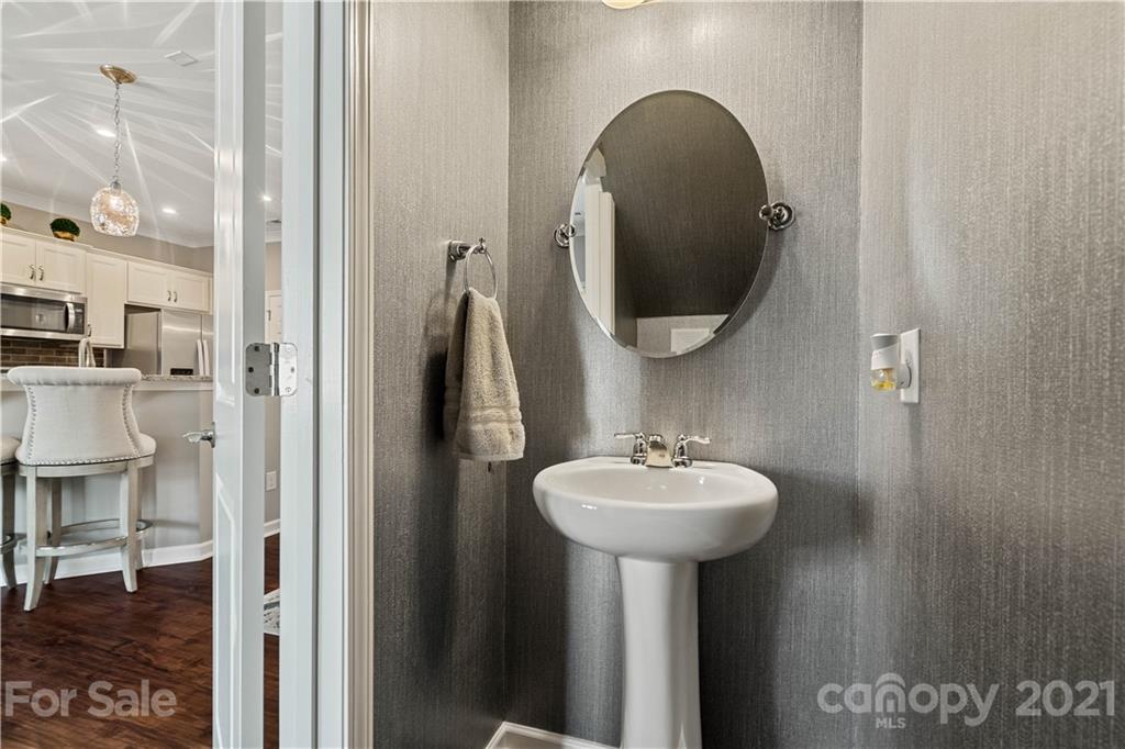 921 Wicawa Road, Unit 309 Fort Mill, SC 29708 - Photo 13 of 28 a bathroom with a sink and a mirror