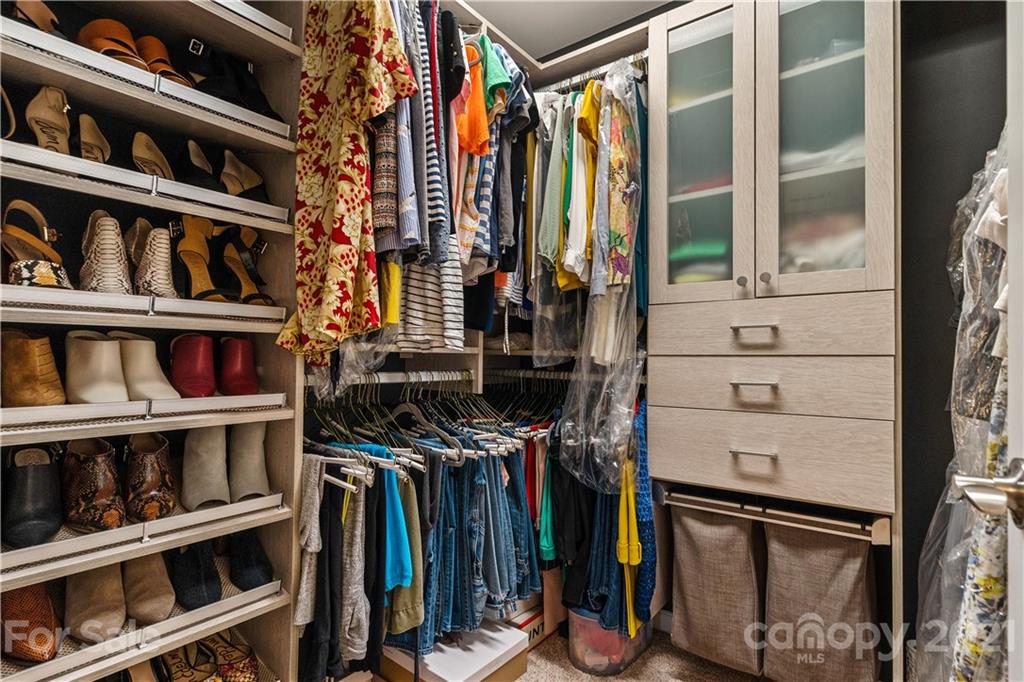 921 Wicawa Road, Unit 309 Fort Mill, SC 29708 - Photo 18 of 28 a view of walk in closet with clothes and shoes