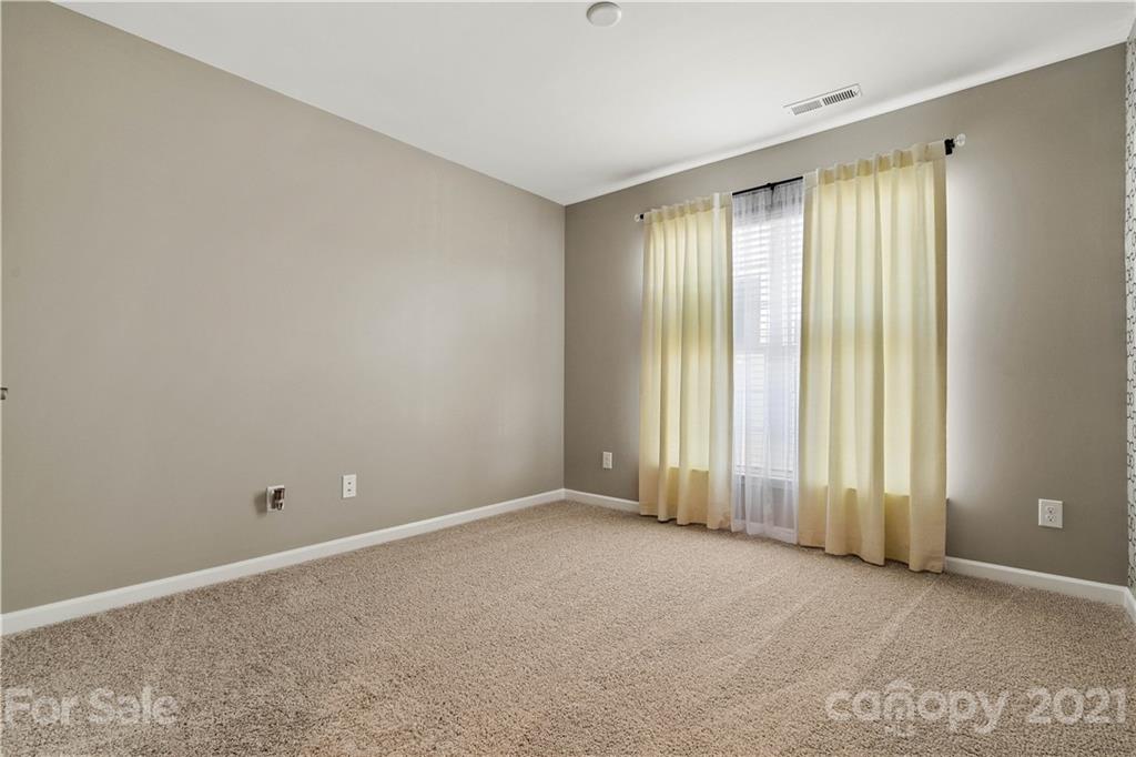 921 Wicawa Road, Unit 309 Fort Mill, SC 29708 - Photo 19 of 28 an empty room with a window