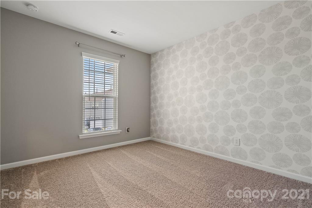 921 Wicawa Road, Unit 309 Fort Mill, SC 29708 - Photo 21 of 28 an empty room with windows