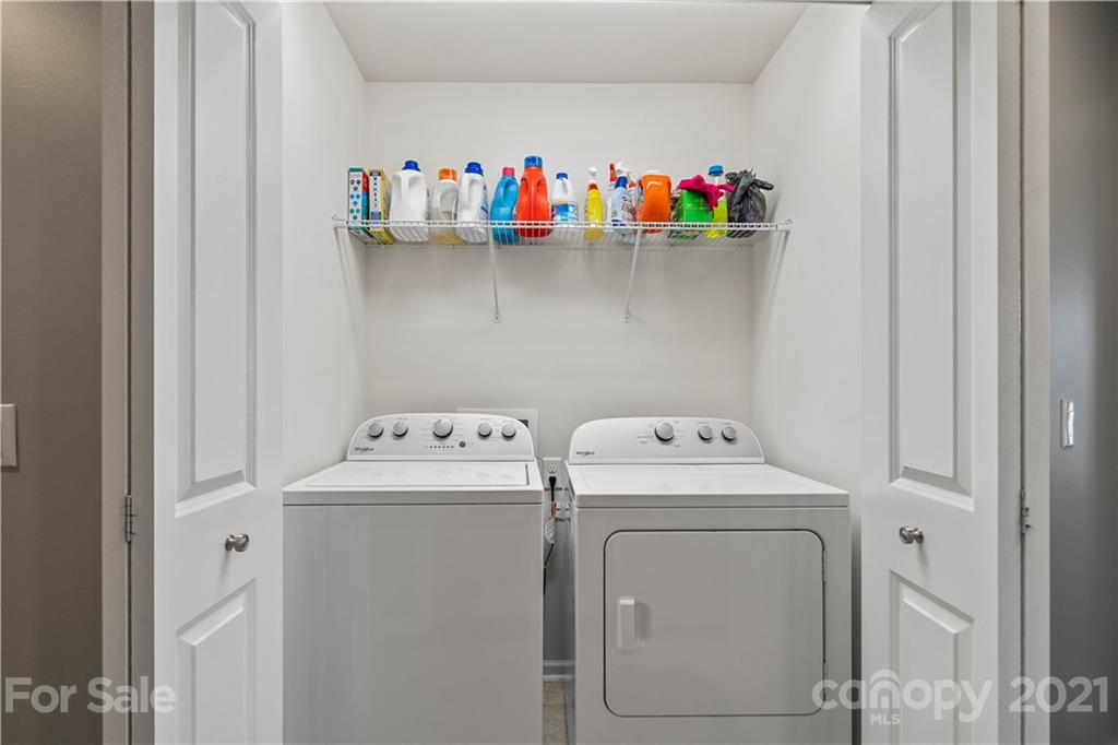 921 Wicawa Road, Unit 309 Fort Mill, SC 29708 - Photo 24 of 28 a utility room with dryer and washer