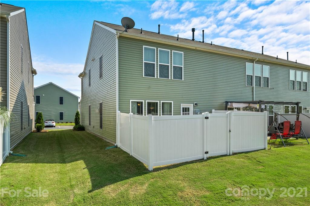 921 Wicawa Road, Unit 309 Fort Mill, SC 29708 - Photo 26 of 28 a view of a house with a yard
