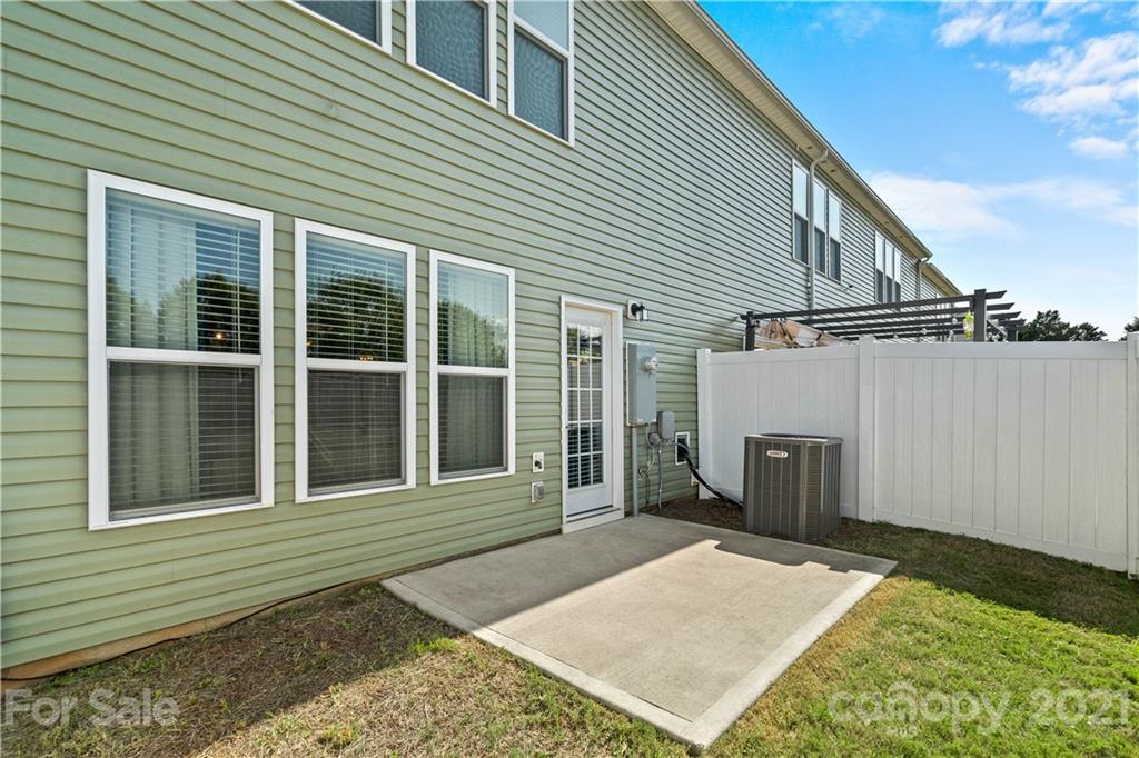 921 Wicawa Road, Unit 309 Fort Mill, SC 29708 - Photo 27 of 28 a view of a house with a backyard