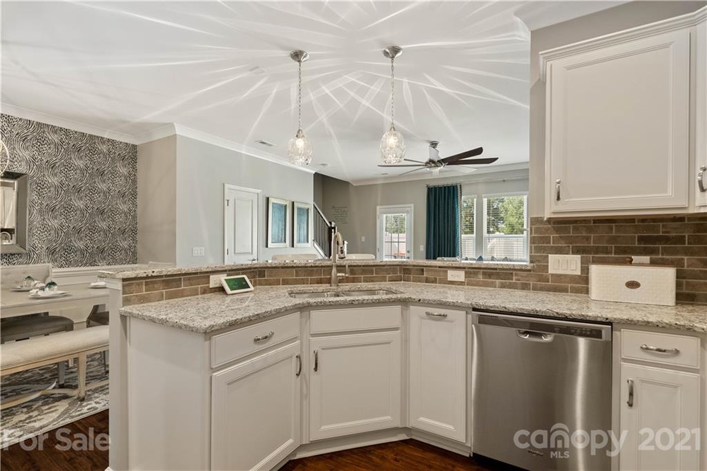 921 Wicawa Road, Unit 309 Fort Mill, SC 29708 - Photo 9 of 28 a kitchen with a sink stove and cabinets