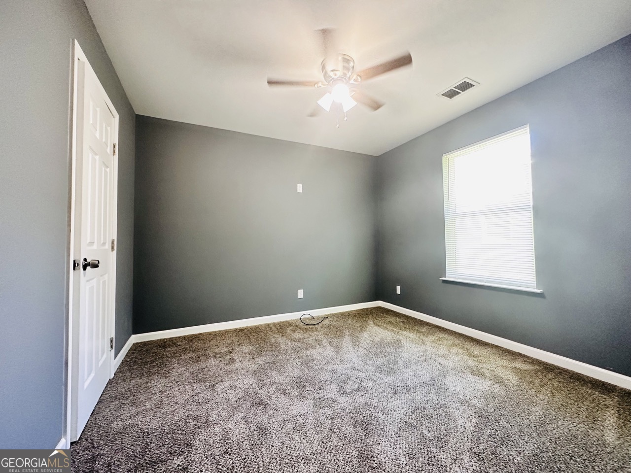 459 Merrywood Drive, Unit B LaGrange, GA 30241 - Photo 12 of 15 a view of an empty room with a window
