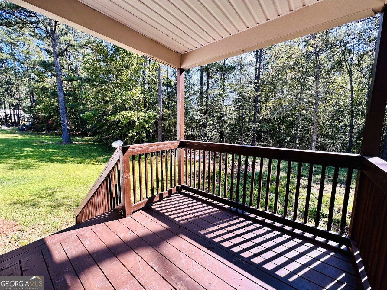 459 Merrywood Drive, Unit B LaGrange, GA 30241 - Photo 5 of 15 a view of balcony with wooden floor and fence