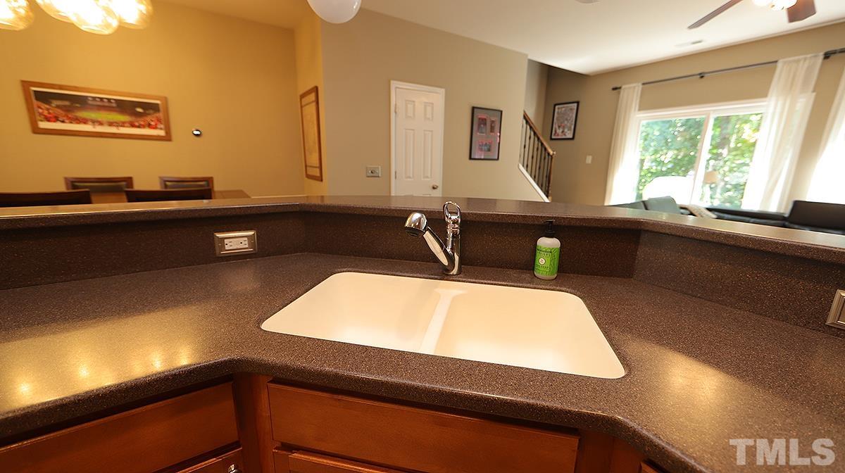 7020 Racine Way Raleigh, NC 27690 - Photo 9 of 26 a bathroom with a sink and a window