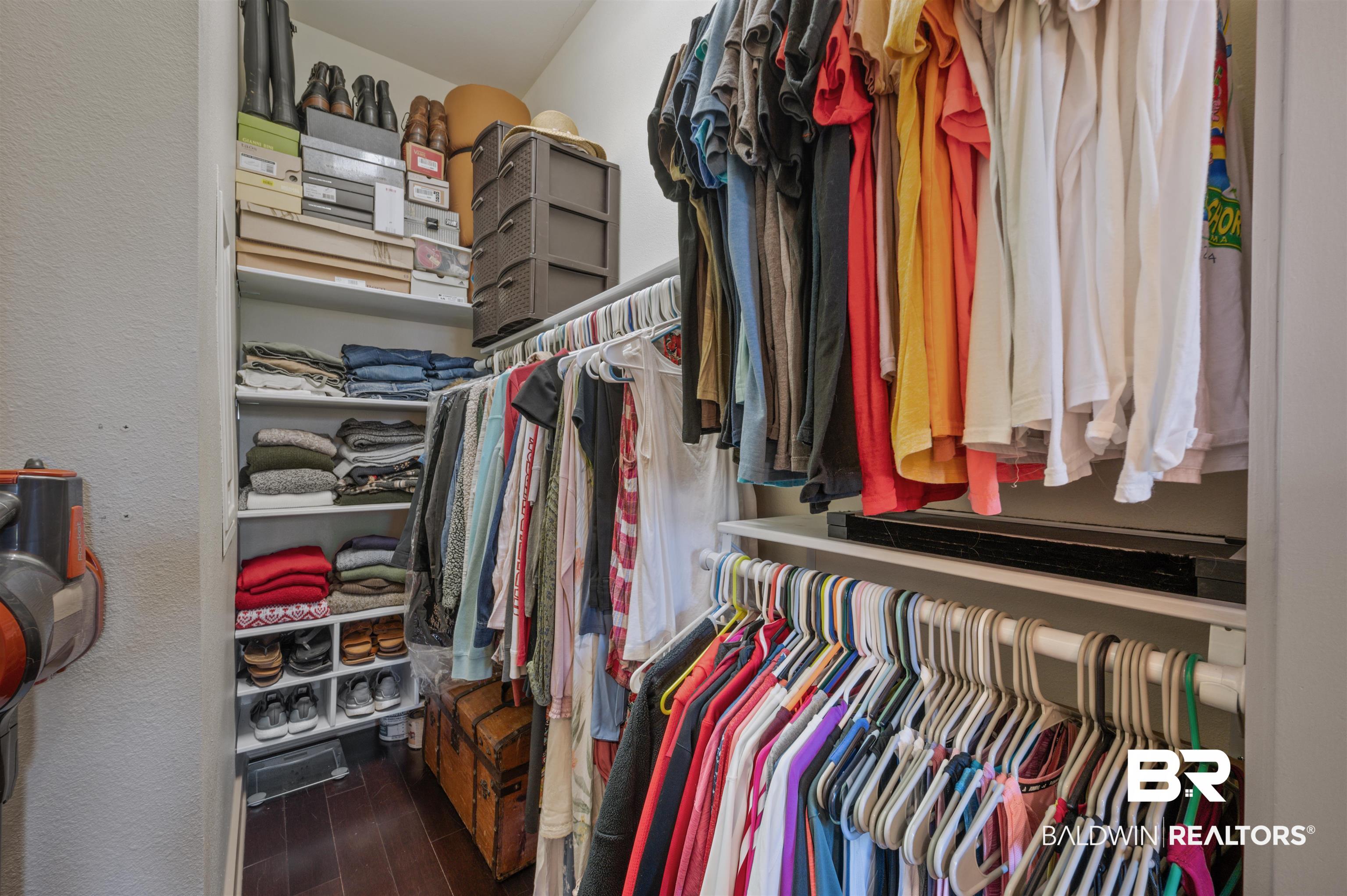 1430 Regency Road, Unit B202 Gulf Shores, AL 36542 - Photo 13 of 33 Spacious closet with wood finished floors