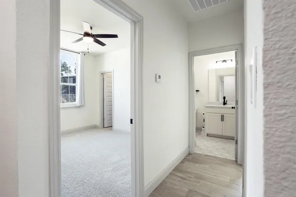 a view of an empty room and a window