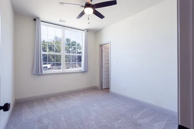 a bathroom with a granite countertop toilet sink and shower