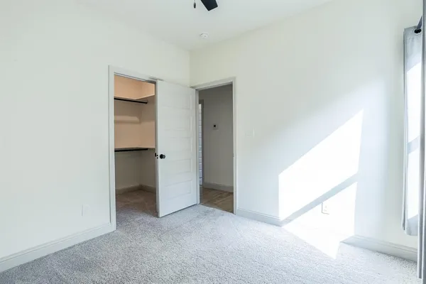 a bathroom with a sink vanity and a toilet
