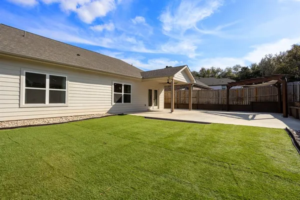 a view of a backyard with a tv