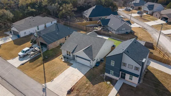 an aerial view of a house with outdoor space