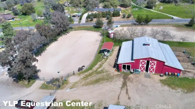 an aerial view of a house a yard and a fireplace