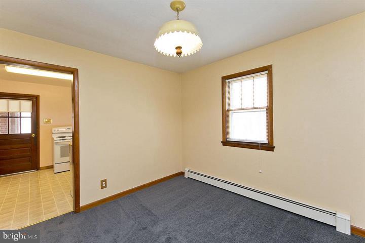 1610 South Loudoun Street Winchester, VA 22601 - Photo 11 of 38 an empty room with windows and entrance