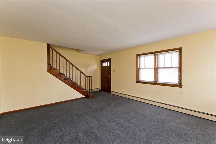 1610 South Loudoun Street Winchester, VA 22601 - Photo 4 of 38 a view of an empty room with stairs