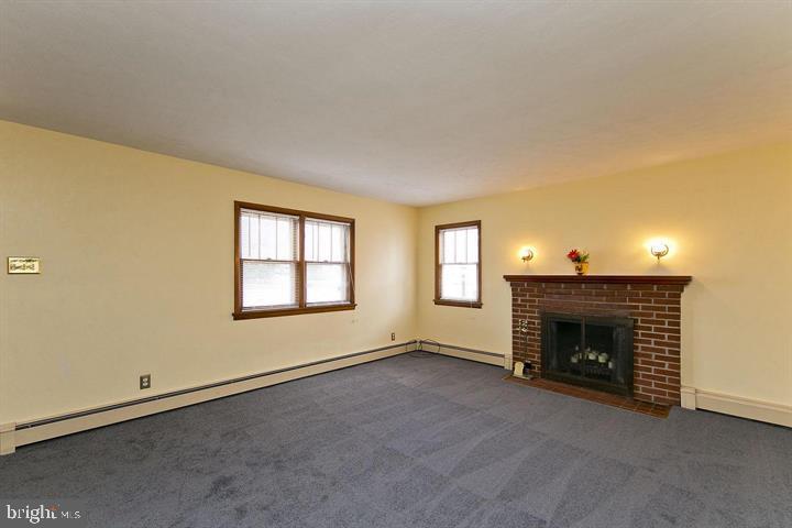 1610 South Loudoun Street Winchester, VA 22601 - Photo 5 of 38 a view of empty room with a fireplace
