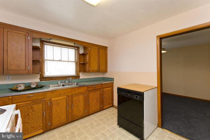 1610 South Loudoun Street Winchester, VA 22601 - Photo 8 of 38 a kitchen with stainless steel appliances granite countertop a sink and a stove