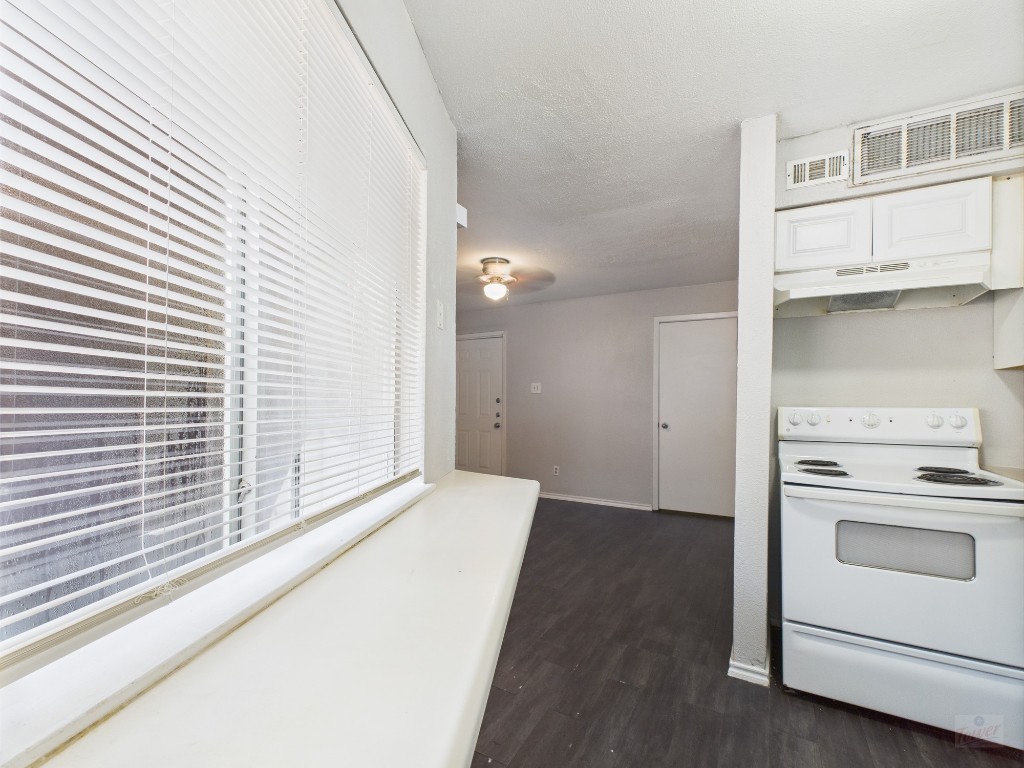 1840 Burton Drive, Unit 141 Austin, TX 78741 - Photo 14 of 24 a view of a kitchen with a stove cabinets