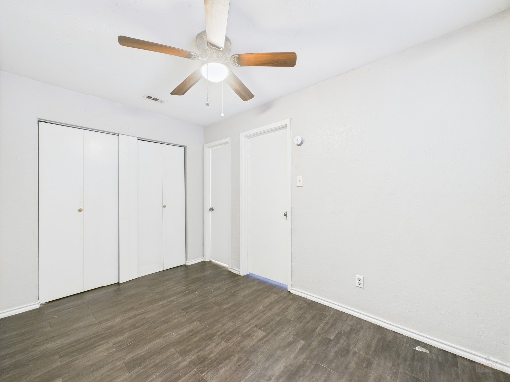 1840 Burton Drive, Unit 141 Austin, TX 78741 - Photo 18 of 24 wooden floor in an empty room
