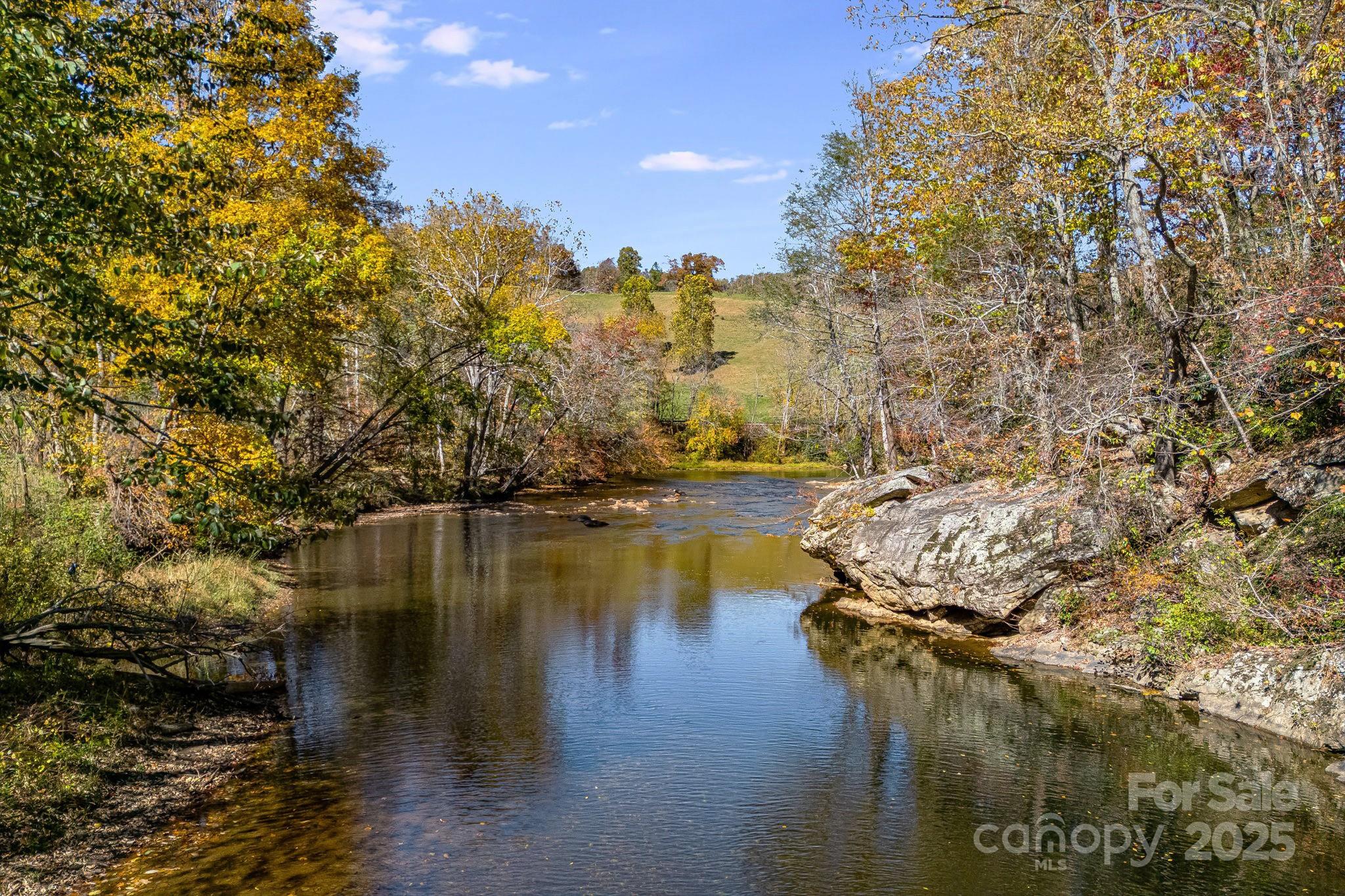 99 Thistle Ridge Canton, NC 28716 - Photo 2 of 48 a view of a lake with houses