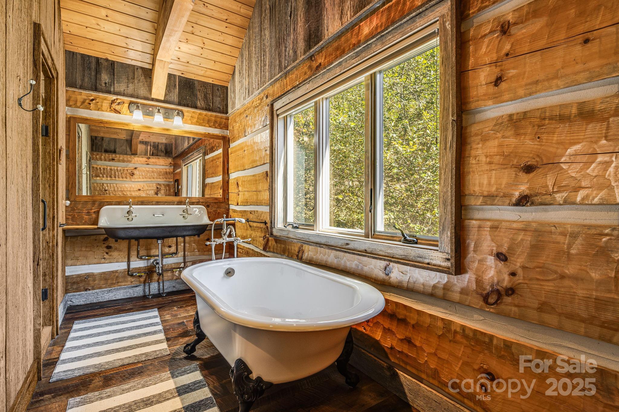 99 Thistle Ridge Canton, NC 28716 - Photo 25 of 48 a bathroom with a sink and a mirror