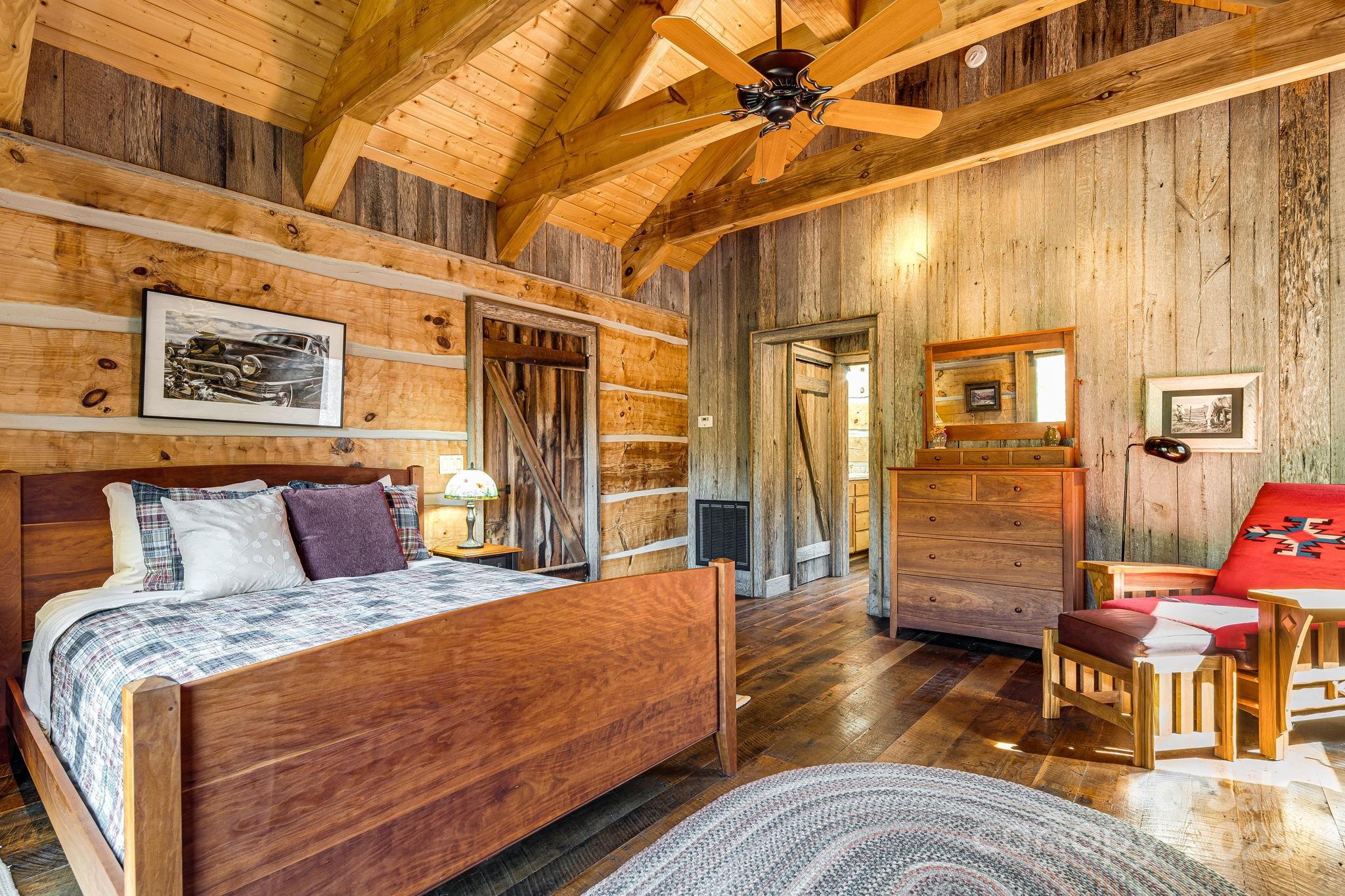 99 Thistle Ridge Canton, NC 28716 - Photo 29 of 48 a bed room with a bed and wooden floor