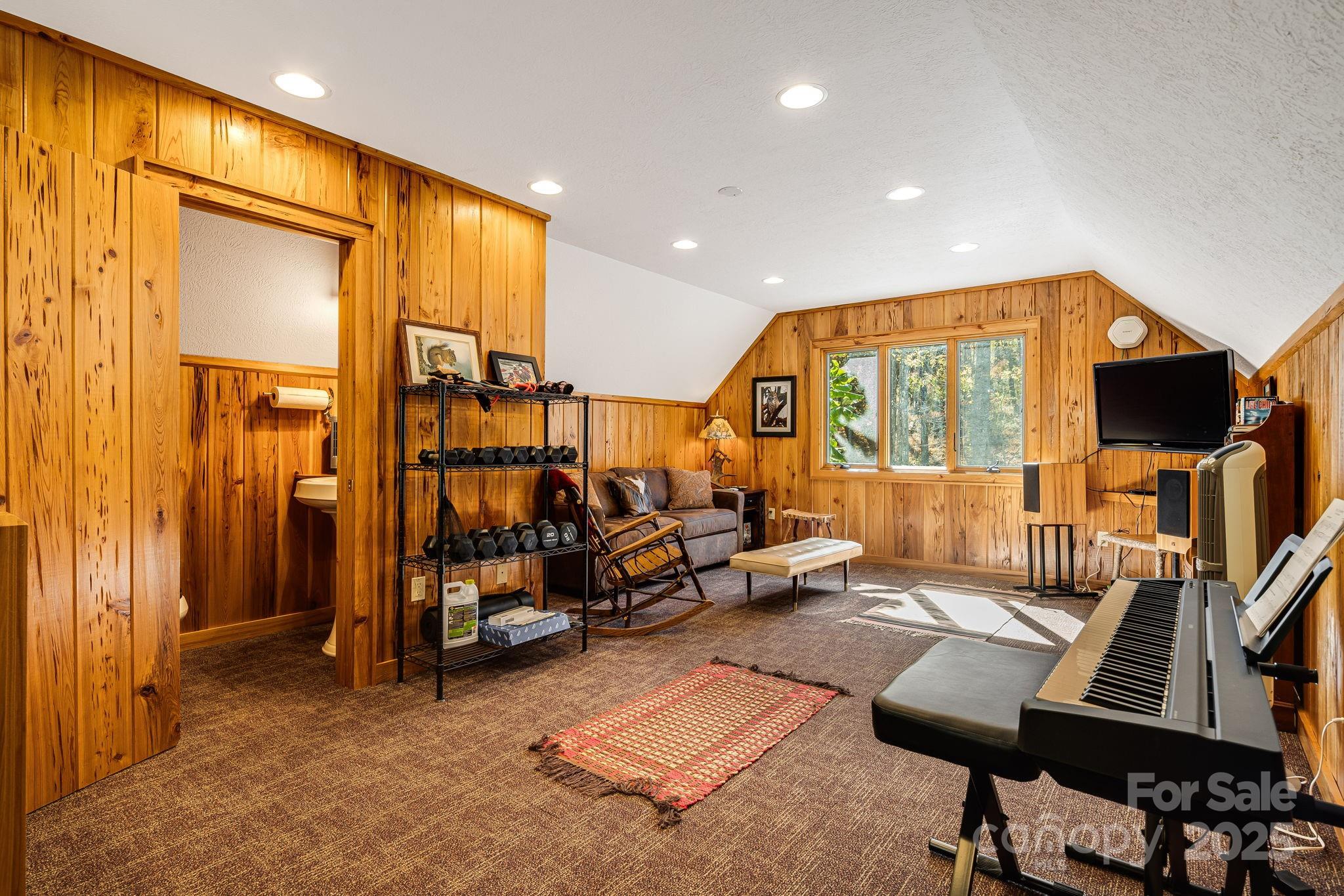99 Thistle Ridge Canton, NC 28716 - Photo 36 of 48 a view of game room with window and couch
