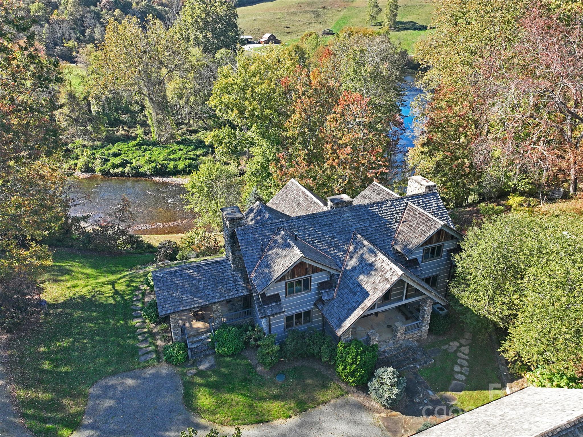99 Thistle Ridge Canton, NC 28716 - Photo 4 of 48 an aerial view of a house with a yard basket ball court and outdoor seating