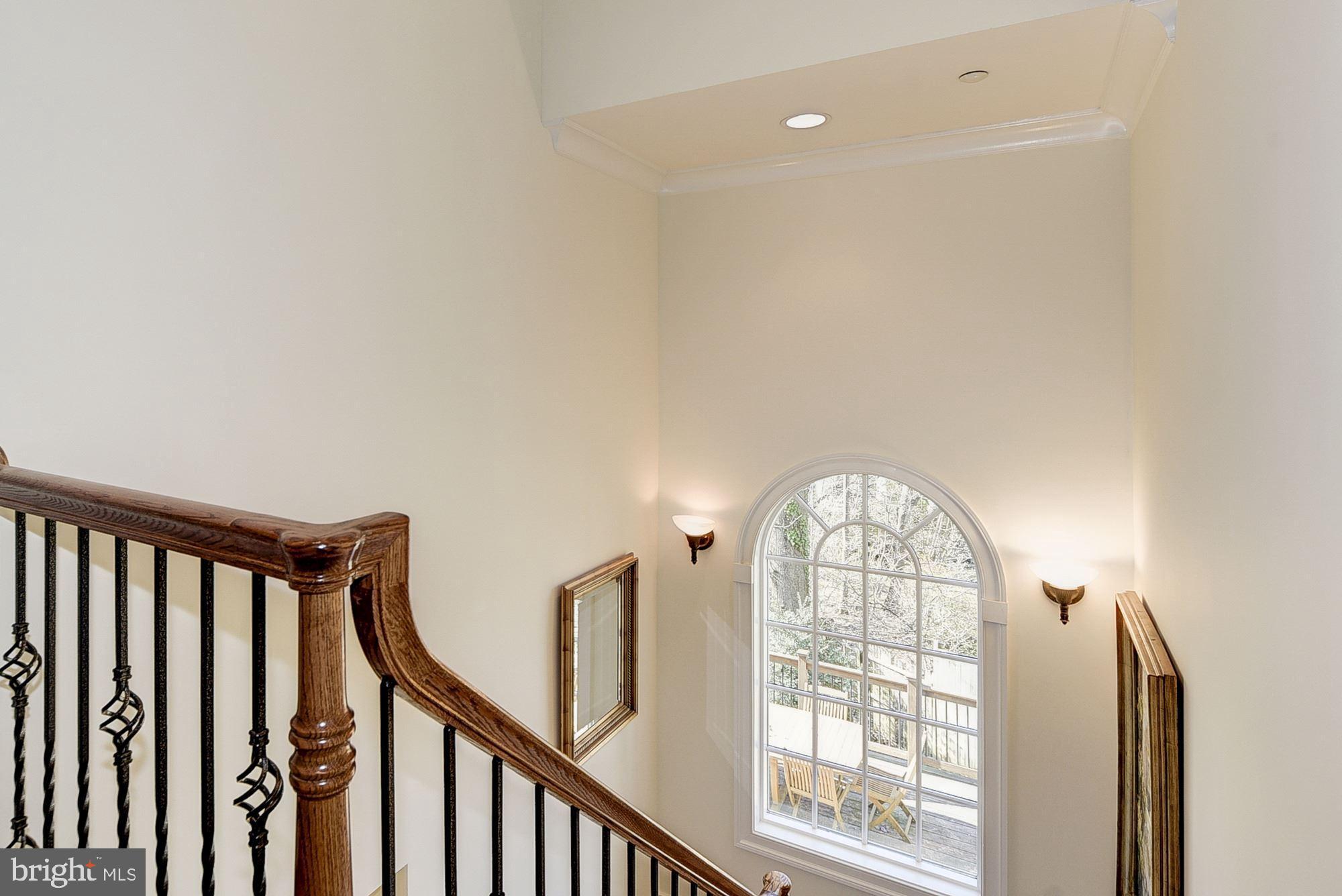 8586 Brickyard Road Potomac, MD 20854 - Photo 23 of 49 TWO STORY BACK STAIRCASE WITH PALLADIAN WINDOW