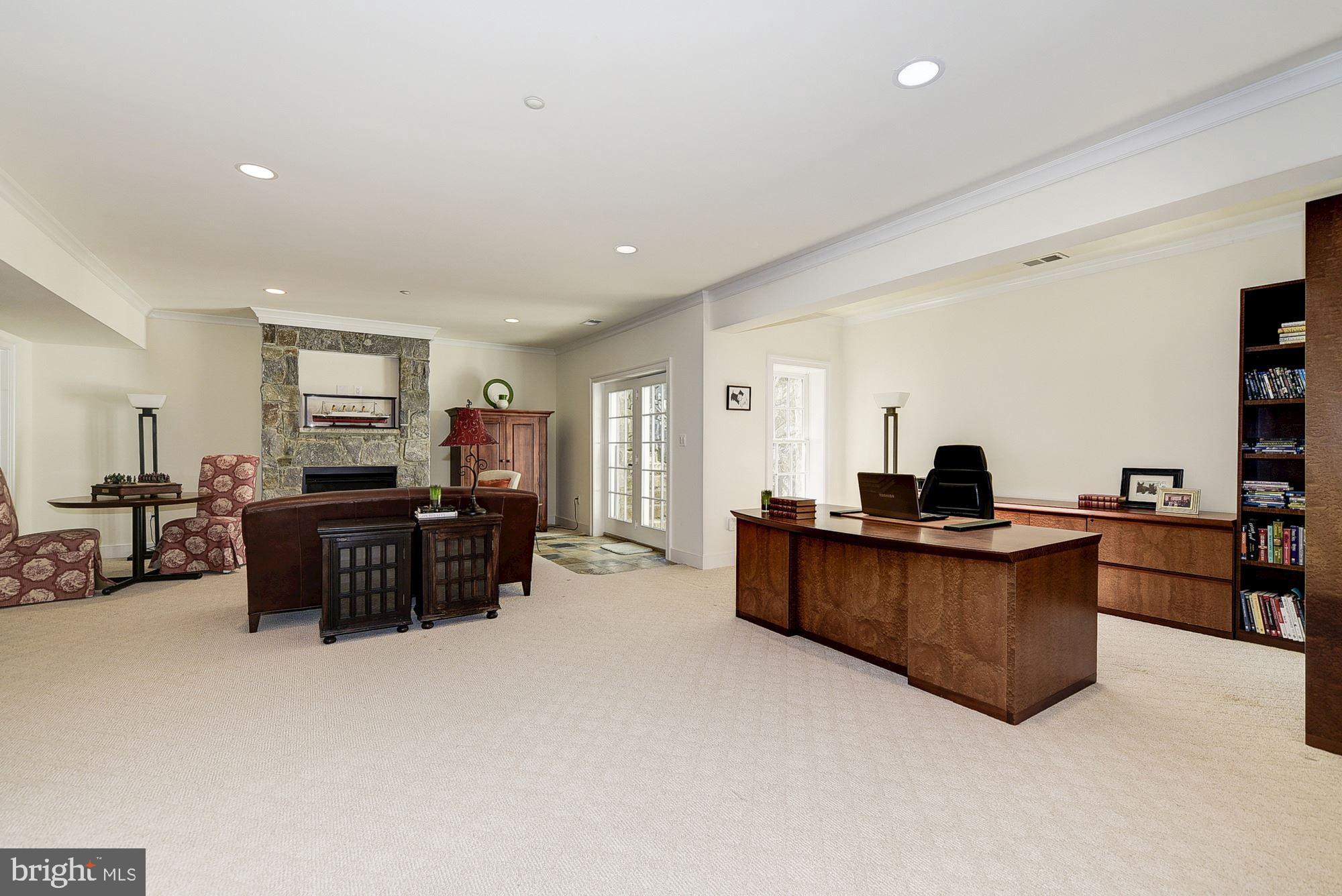 8586 Brickyard Road Potomac, MD 20854 - Photo 38 of 49 LL GAME ROOM / FAMILY ROOM WITH GAS FIREPLACE