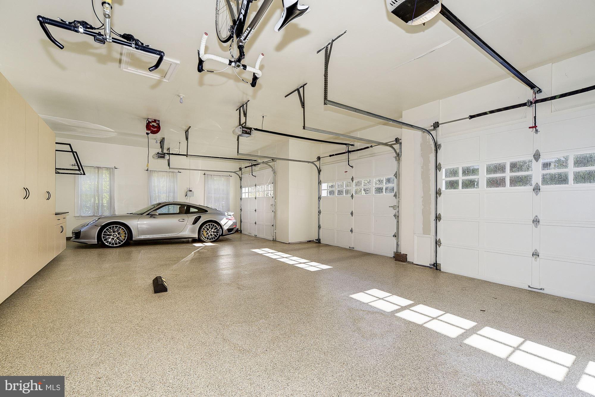 8586 Brickyard Road Potomac, MD 20854 - Photo 44 of 49 GARAGE WITH BUILT-INS AND EPOXY FLOOR