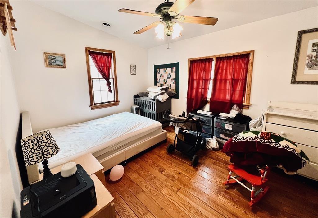 13478 Old Lake Road, Unit 63 East Springfield, PA 16411 - Photo 14 of 18 a bedroom with furniture and wooden floor