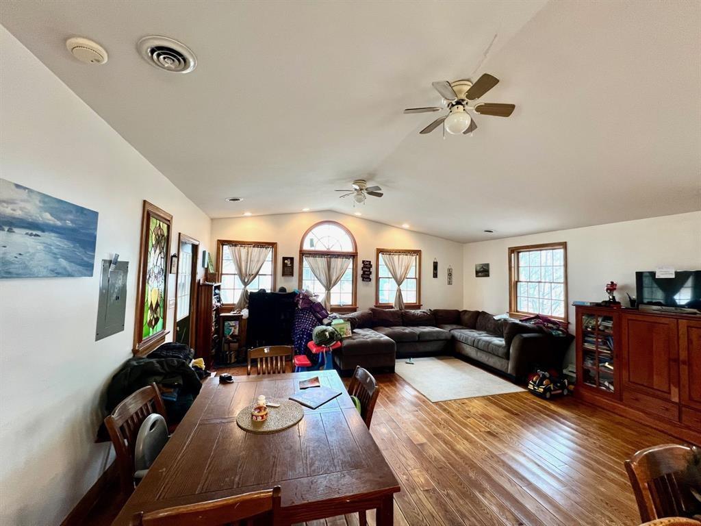 13478 Old Lake Road, Unit 63 East Springfield, PA 16411 - Photo 15 of 18 a living room with furniture fireplace and a window