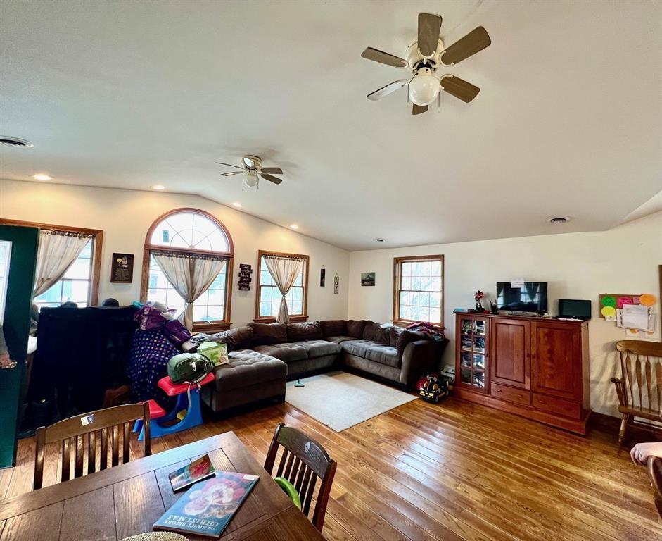 13478 Old Lake Road, Unit 63 East Springfield, PA 16411 - Photo 4 of 18 a living room with furniture a fireplace and a chandelier