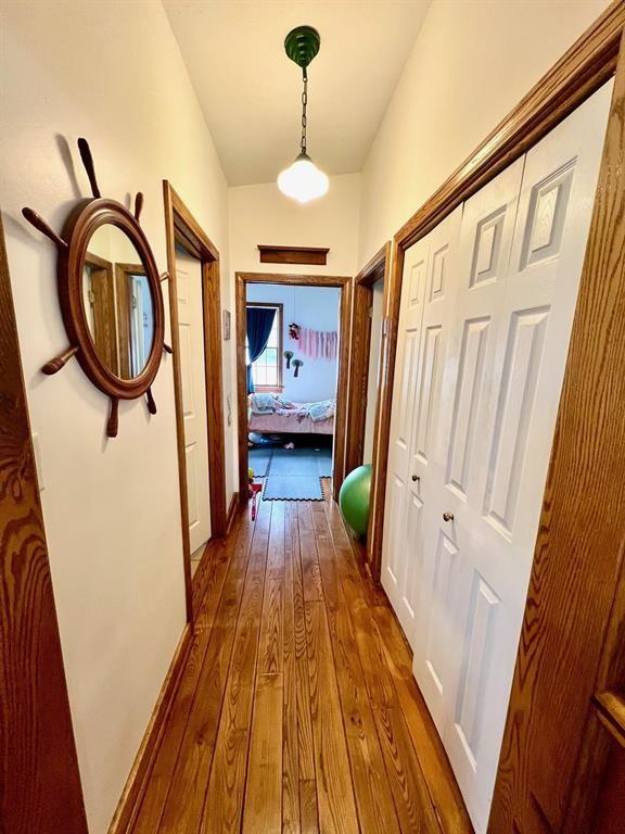 13478 Old Lake Road, Unit 63 East Springfield, PA 16411 - Photo 8 of 18 a view of a hallway with wooden floor and staircase