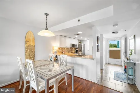 a large white bed in a white room