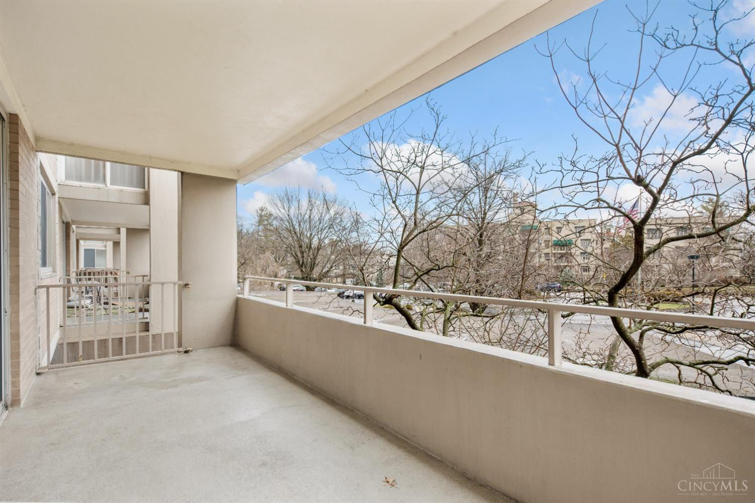 2324 Madison Road, Unit 204 Cincinnati, OH 45208 - Photo 17 of 34 Spacious balcony provides plenty of room for both table and seating areas. (This pic was taken in the winter, this magnolia tree provides beautiful foliage and blooms.