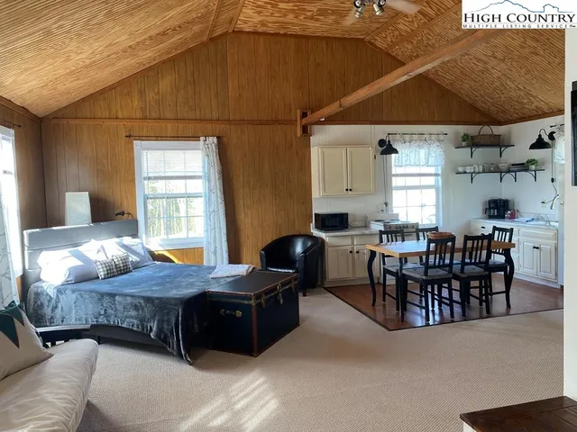 a bedroom with furniture and windows