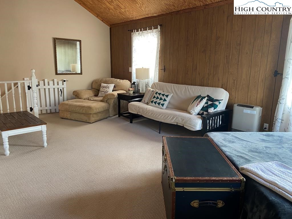 562 Nikanor Road, Unit UPPER LEVEL SUITE West Jefferson, NC 28694 - Photo 3 of 11 a living room with furniture and a window